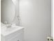 Updated half bathroom with new vanity, sink, mirror, and modern fixtures at 4126 Dream Catcher Dr, Woodstock, GA 30189