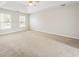 Large Primary bedroom with tray ceiling, carpet floors and lots of natural light at 4126 Dream Catcher Dr, Woodstock, GA 30189