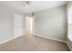 Bedroom with ceiling fan, natural lighting, and closet at 4126 Dream Catcher Dr, Woodstock, GA 30189
