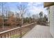 Spacious deck offers serene backyard views, perfect for entertaining or enjoying nature at 4126 Dream Catcher Dr, Woodstock, GA 30189