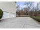 Long driveway leading to a two-car garage at 4126 Dream Catcher Dr, Woodstock, GA 30189