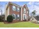 Attractive two-story brick home with manicured lawn, shutters, and inviting entrance at 4126 Dream Catcher Dr, Woodstock, GA 30189