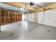 Spacious garage with concrete floor, storage cabinets and dual doors at 4126 Dream Catcher Dr, Woodstock, GA 30189