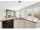 Bright kitchen featuring granite countertops, a stainless steel dishwasher, and views of the living room at 4126 Dream Catcher Dr, Woodstock, GA 30189
