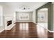 Open concept living room features hardwood flooring, fireplace and many windows at 4126 Dream Catcher Dr, Woodstock, GA 30189