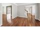 Open living room area showcasing hardwood flooring, neutral walls, and archway at 4126 Dream Catcher Dr, Woodstock, GA 30189
