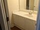 Cozy bathroom with white cabinets, a single sink, and a clean, neutral design at 1272 Creekside Se Ter, Smyrna, GA 30082