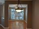 Cozy dining room with hardwood floors and a large window with plenty of natural light at 1272 Creekside Se Ter, Smyrna, GA 30082