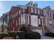 Charming brick townhome with a two-car garage and a beautifully landscaped front yard at 1272 Creekside Se Ter, Smyrna, GA 30082