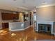 Spacious living room and kitchen with hardwood floors, fireplace, and stainless steel appliances at 1272 Creekside Se Ter, Smyrna, GA 30082