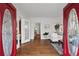 Bright foyer featuring hardwood floors, white trim, and an open doorway to the living room at 1280 N Morningside Ne Dr, Atlanta, GA 30306