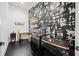 Modern laundry room with artistic wall, washer and dryer, and a folding desk at 1598 Athens Sw Ave, Atlanta, GA 30310