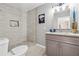 Contemporary bathroom with tiled shower, granite vanity, and recessed lighting creating a modern and functional space at 3482 Atlanta St, Atlanta, GA 30337