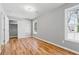 Bedroom featuring hardwood floors, closet, and two windows that offer plenty of natural light and a relaxing space at 3482 Atlanta St, Atlanta, GA 30337