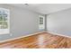 Bright bedroom with hardwood floors and two windows that offer plenty of natural light and a relaxing space at 3482 Atlanta St, Atlanta, GA 30337