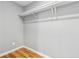 Empty closet featuring a shelf with supports and light hardwood floors providing ample space at 3482 Atlanta St, Atlanta, GA 30337
