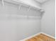 Bedroom closet featuring hardwood floors, closet rod, and a window that offers plenty of natural light and a relaxing space at 3482 Atlanta St, Atlanta, GA 30337