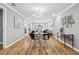 Spacious dining room featuring hardwood floors and open access to the living room and kitchen at 3482 Atlanta St, Atlanta, GA 30337
