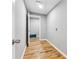 Hallway with hardwood floors features a door and access to other rooms inside of home at 3482 Atlanta St, Atlanta, GA 30337