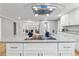 A kitchen featuring an island with a granite countertop, stainless steel appliances, and eat-in seating at 3482 Atlanta St, Atlanta, GA 30337