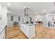 Contemporary kitchen featuring an island with a cooktop and views to other living spaces at 3482 Atlanta St, Atlanta, GA 30337
