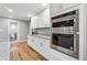 A kitchen featuring stainless steel appliances, granite countertops, and hardwood floors at 3482 Atlanta St, Atlanta, GA 30337