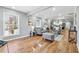Inviting living room with hardwood floors, neutral decor, and abundant natural light from multiple windows at 3482 Atlanta St, Atlanta, GA 30337