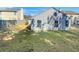 Backyard featuring a well manicured lawn, mature tree, and full privacy fence at 7175 Bowie Dr, Lithonia, GA 30038
