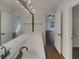 Bright bathroom featuring an expansive mirror, and well-lit vanity area at 7175 Bowie Dr, Lithonia, GA 30038