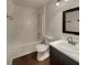 Bathroom features a shower-tub combination, new sink and modern fixtures at 7175 Bowie Dr, Lithonia, GA 30038