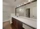 Bathroom featuring long vanity with modern fixtures, and large mirror at 7175 Bowie Dr, Lithonia, GA 30038