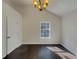 Bedroom featuring large windows, vaulted ceiling, and hardwood floors at 7175 Bowie Dr, Lithonia, GA 30038