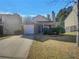 Charming single-story home with attached garage and manicured front yard landscaping at 7175 Bowie Dr, Lithonia, GA 30038