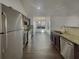 Open kitchen featuring stainless steel appliances and eat-in breakfast bar at 7175 Bowie Dr, Lithonia, GA 30038