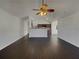 Open-concept living room with hardwood floors, recessed lighting, and vaulted ceiling at 7175 Bowie Dr, Lithonia, GA 30038