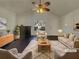 Bright living room with fireplace, ceiling fan, and plenty of space for entertaining at 7175 Bowie Dr, Lithonia, GA 30038