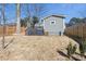 Backyard view featuring the patio, wooden fence, and a well-maintained lawn at 853 Gaston Sw St, Atlanta, GA 30310