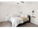 Simple bedroom with neutral walls, carpet, and industrial-style wall sconces at 853 Gaston Sw St, Atlanta, GA 30310