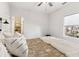Bright bedroom featuring a ceiling fan, neutral walls, and a walk-in closet in a modern home at 853 Gaston Sw St, Atlanta, GA 30310