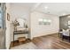 Bright foyer with hardwood floors, mirror and a view into the living and dining space at 853 Gaston Sw St, Atlanta, GA 30310