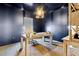 Stylish home office with moody blue walls, natural light, and a modern desk space at 853 Gaston Sw St, Atlanta, GA 30310
