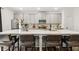 Modern kitchen with a large center island and bar stool seating and stainless steel appliances at 853 Gaston Sw St, Atlanta, GA 30310