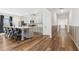 Bright kitchen with gray cabinets, quartz countertops, stainless steel appliances, and island with seating at 853 Gaston Sw St, Atlanta, GA 30310