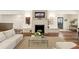 Inviting living room with fireplace, hardwood floors, comfortable seating, and natural light at 853 Gaston Sw St, Atlanta, GA 30310