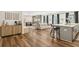 Spacious open-concept living room featuring hardwood floors, a modern kitchen island, and elegant decor at 853 Gaston Sw St, Atlanta, GA 30310