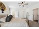 Airy main bedroom featuring neutral walls, plush carpet, and multiple access doors at 853 Gaston Sw St, Atlanta, GA 30310