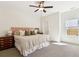 Spacious main bedroom featuring a king bed, ceiling fan, and natural light at 853 Gaston Sw St, Atlanta, GA 30310