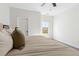 Bright main bedroom featuring a king bed, ceiling fan, and natural light at 853 Gaston Sw St, Atlanta, GA 30310