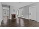 Cozy living room with hardwood floors, a brick fireplace, and neutral wall paint at 960 Byron Sw Dr, Atlanta, GA 30310