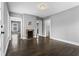 Inviting living room featuring hardwood floors, neutral paint, and a cozy brick fireplace at 960 Byron Sw Dr, Atlanta, GA 30310